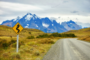 Winging road sign in Torres del Paine
