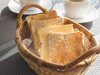 Toasted bread in basket breakfast set with coffee