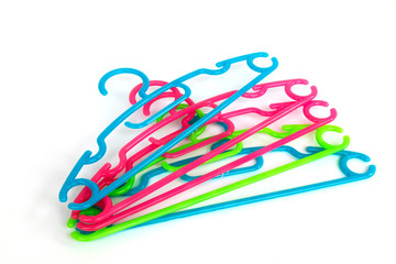 Plastic hangers for shirt,coat and pants isolated on white backg