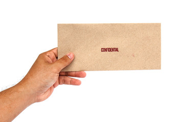 Hand holding Brown envelope with confidential stamp