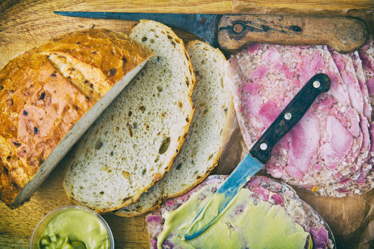 Onion bread with headcheese and mustard