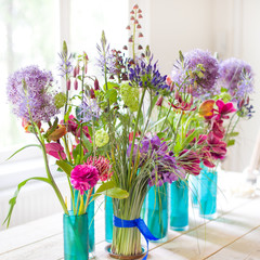 Beautiful spring flowers on wooden table.