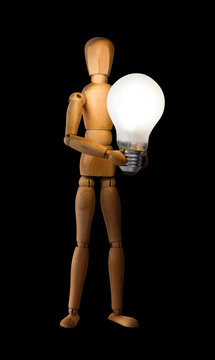 Wooden mannequin holding light bulb