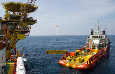 Close-up of a supply vessel transporting cargo to nearby rigs