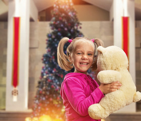 Cute small girl  with toy bear