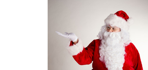 Santa Claus with blank board for text