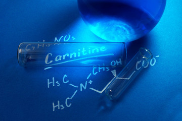 the chemical formula of carnitine with  test tubes