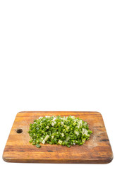 Spring onion or scallions on wooden cutting board 