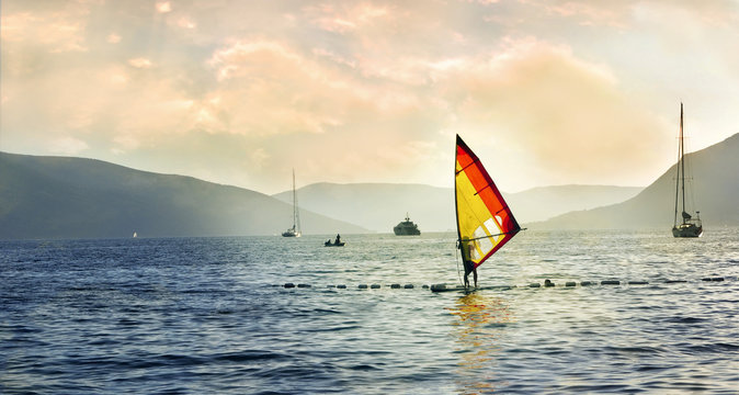 Windsurfer out at the sea, summertime scene