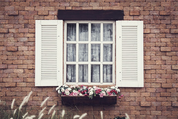 Fototapeta na wymiar Vintage style Windows on brick wall