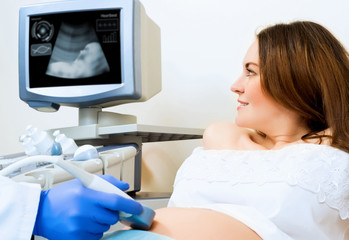 pregnant woman on reception at the doctor