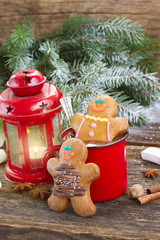 Gingerbread men with mug of hot chocolate