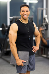 Fototapeta na wymiar muscular male gym trainer