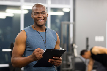 young african american male personal trainer - 73586308