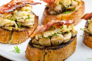 Rustic breakfast - bread toast, mushrooms, eggs