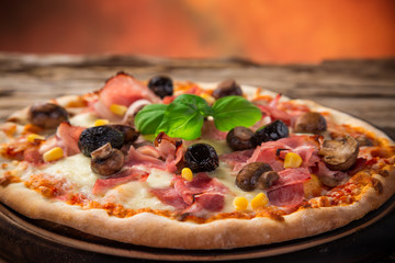 Delicious italian pizza served on wooden table