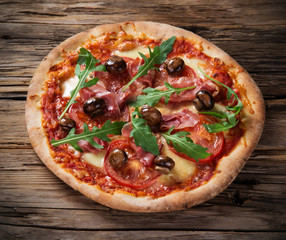 Delicious italian pizza served on wooden table