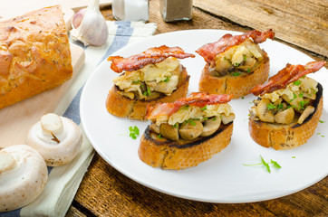 Rustic breakfast - bread toast, mushrooms, eggs