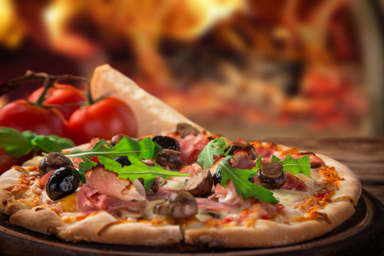 Delicious italian pizza served on wooden table