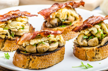 Rustic breakfast - bread toast, mushrooms, eggs