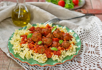 Pasta with mini meatballs with tomato sauce