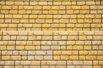 yellow wall with stone bricks