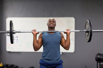 african american man lifting barbell