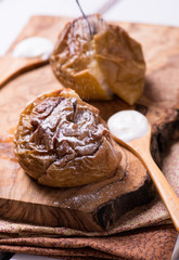 Baked apples on wooden board