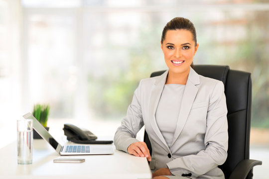 young business woman sitting in office
