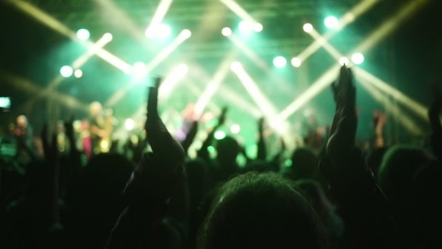 People dancing at open air rock festival