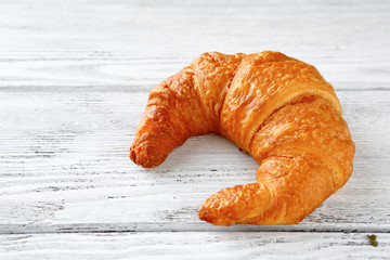 one ruddy French croissant
