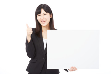 Fototapeta premium メッセージボードを持ってグッドサインするビジネスウーマン