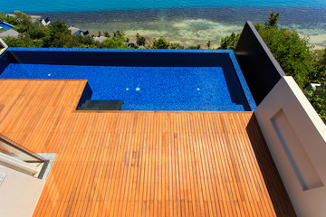 Wooden flooring beside the pool