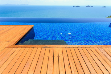 Wooden flooring beside the pool