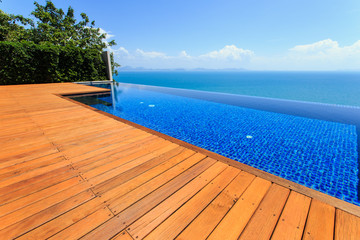 Wooden flooring beside the pool