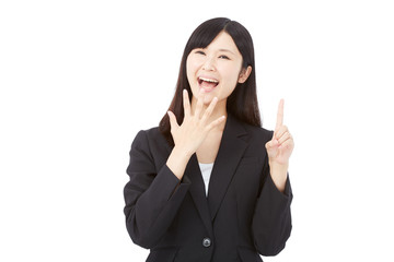 Fototapeta premium 驚いて指差すビジネスウーマン