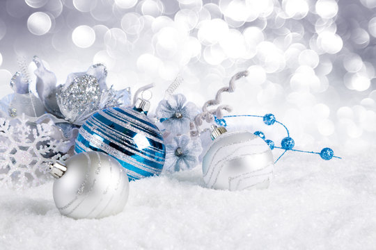 blue christmas balls with decorations on snow