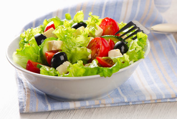 Healthy Greek  salad with feta, olives and vegetables .