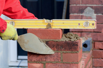 Bricklaying - checking brick is level