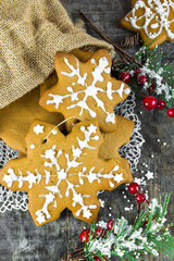Traditional Christmas gingerbread cookies on wooden background