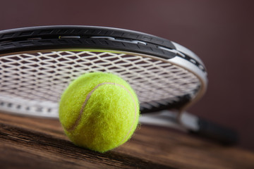 A set of tennis. Racket and ball.