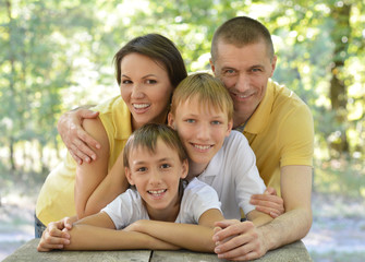 Family outdoors at table