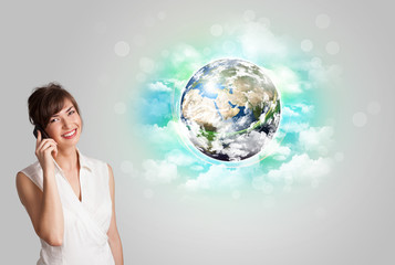 Young woman with earth and cloud concept