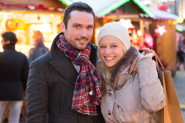 Young attractive couple in a christmas market