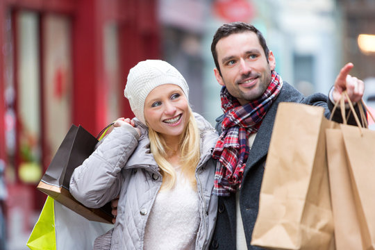 Young attractive couple with shopping bags