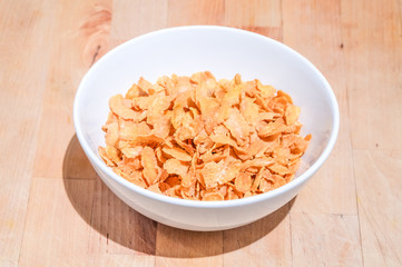 Bowl of cereal on a wooden table background - 73616158