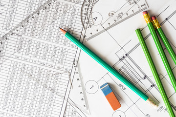 Architectural drawings, many pencils on the table with eraser an