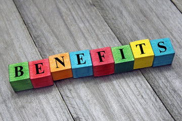concept of benefits word on wooden colorful cubes