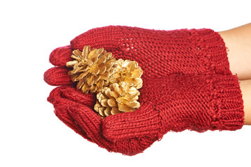 Gold cones in the hands in red gloves