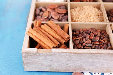 Wooden box with set of coffee and cocoa beans, sugar cubes,
